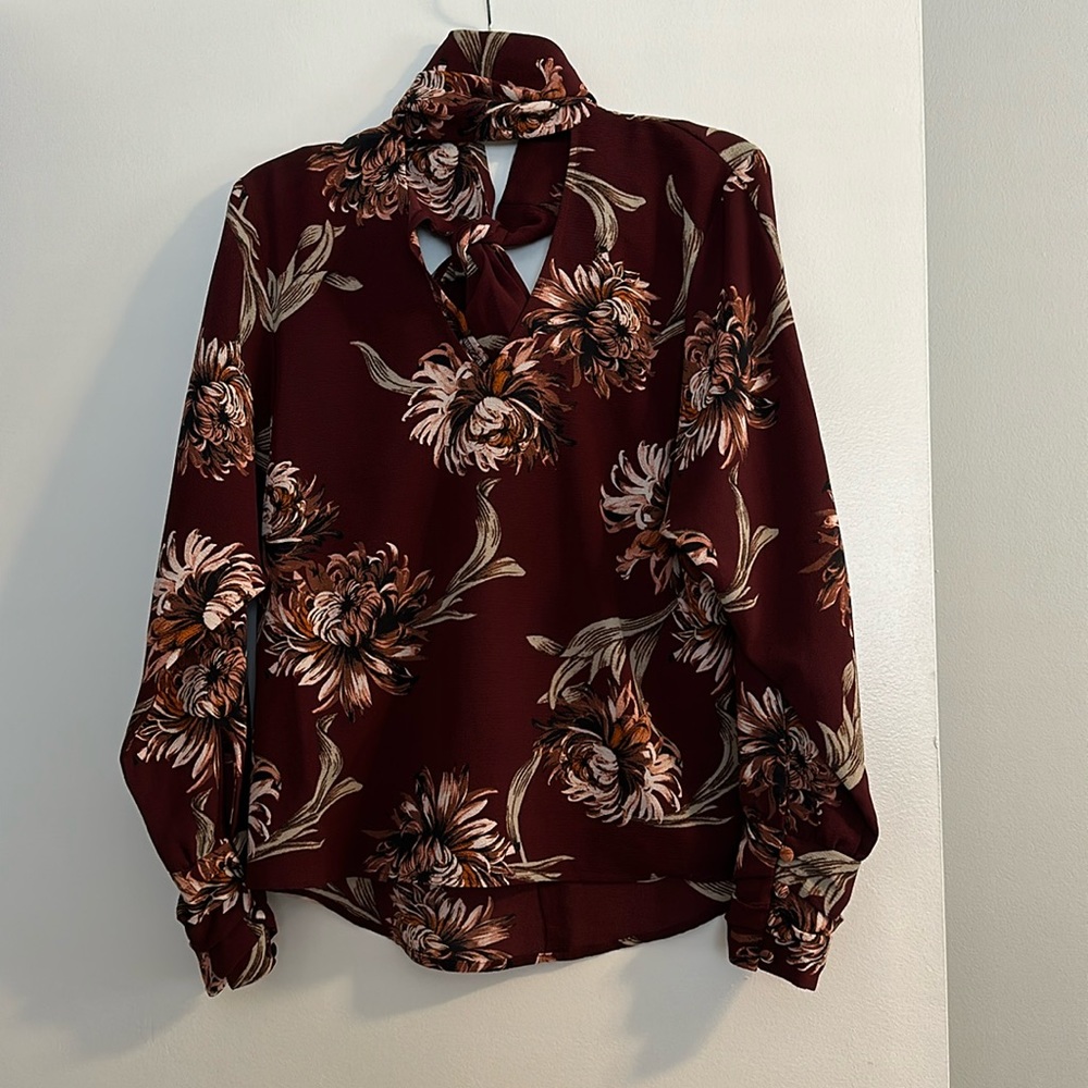 Burgundy floral blouse with bow at back of neck size small